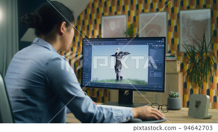 Woman making 3D animation for video game 94642703