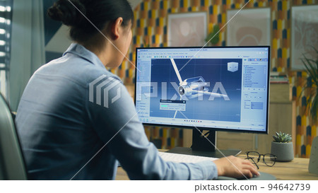 Woman working on 3D modeling project Woman working on 3D modeling project 94642739