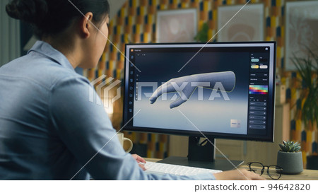 Woman working on 3D model in program 94642820