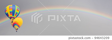 Hot Air Baloons Drift with Rainbow in the Sky. Hot Air Baloons Drift with Rainbow in the Sky. 94643209