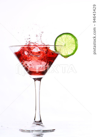 red cocktail with lime on white red cocktail with lime on white 94643429