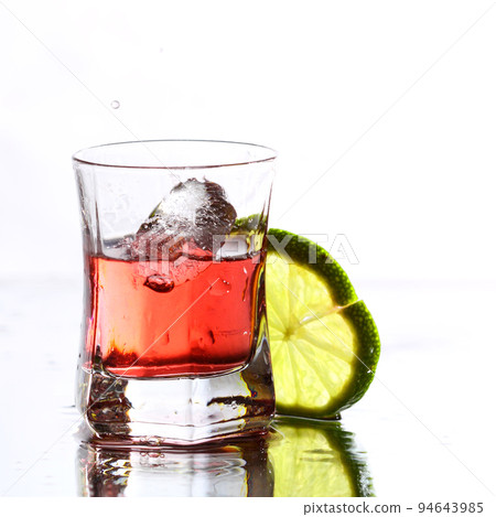 red cocktail with lime on white red cocktail with lime on white 94643985