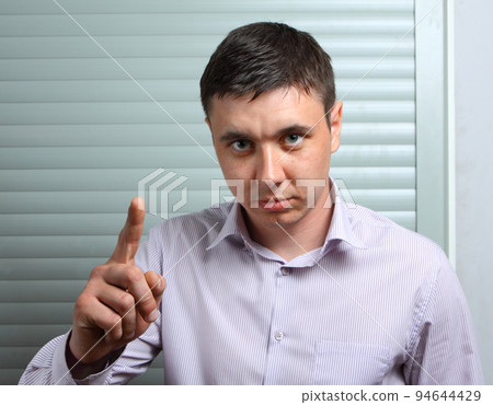 admonishing businessman by finger admonishing businessman by finger 94644429