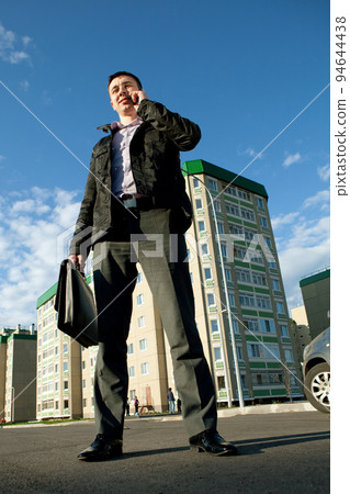 real estate agent on mobile phone real estate agent on mobile phone 94644438