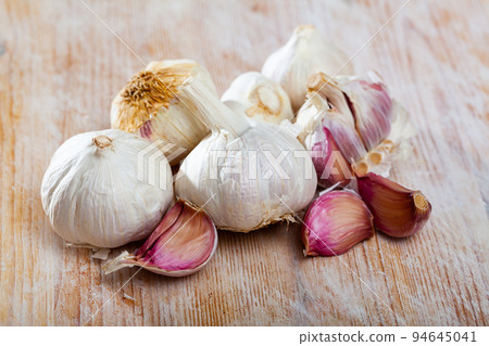 Garlic cloves and bulbs Garlic cloves and bulbs 94645041