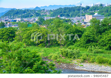 Scenery of the Tone River, Numata city area, Oze area, view of the upstream area from the vicinity of Sagiishi Bridge, early summer season Scenery of the Tone River, Numata city area, Oze area, view of the upstream area from the vicinity of Sagiishi Bridge, early summer season 94645487