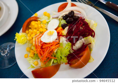 Mixed salad with eggs, fresh vegetables and boiled beet Mixed salad with eggs, fresh vegetables and boiled beet 94645512