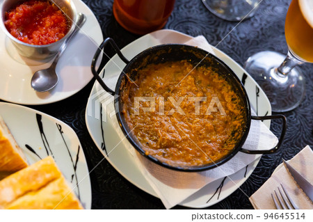 Morteruelo is dish from Cuenca, province of Castilla La Mancha, east of Madrid. It is pate spread of game meats Spain. Morteruelo is dish from Cuenca, province of Castilla La Mancha, east of Madrid. It is pate spread of game meats Spain. 94645514