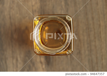 Royal jelly-filled beauty honey in a jar on the table 94647357