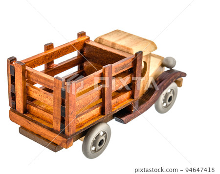 Brown Beige Natural Eco wooden car isolated. Well crafted, covered with stain and varnish, Vintage old toy model in rustic style for kids. 94647418