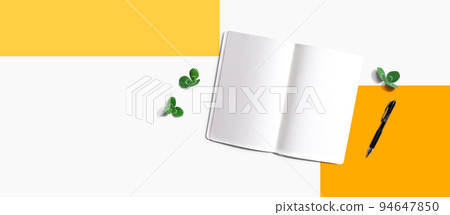 Blank notebook with shamrock leaves 94647850