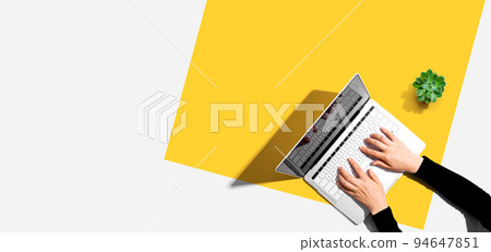 Person using a laptop computer 94647851