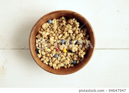 Fruit granola with kid's favorite dried fruits like corn flakes and cereal on the table 94647947