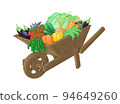 Garden wooden wheelbarrow with vegetables and herbs 94649260