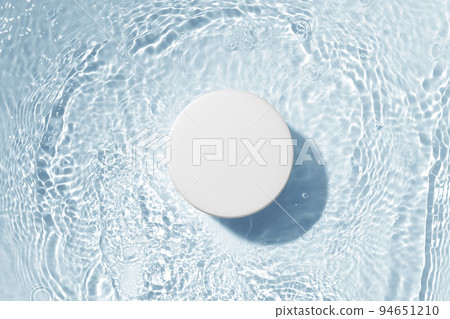 Cosmetic bottles placed on a background with water ripples 94651210