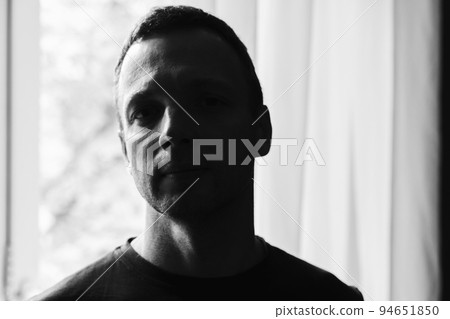 Dark artistic studio portrait of young adult Caucasian man Dark artistic studio portrait of young adult Caucasian man 94651850
