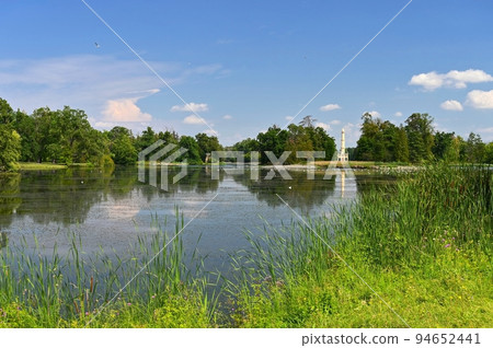 Lednice - South Moravia - Czech Republic. A beautiful park with a lake in the castle grounds. Landscape with nature in summer time. Lednice - South Moravia - Czech Republic. A beautiful park with a lake in the castle grounds. Landscape with nature in summer time. 94652441