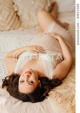 top view. a pregnant woman in white peignoir in... - Stock Photo [94653309] 