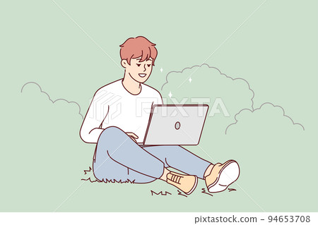 Smiling guy sit outdoors work on computer  94653708