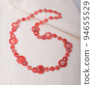 women necklace made of orange colored sea shell 94655529