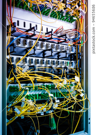 server inside data center with ethernet cables connected to data switch 94655686