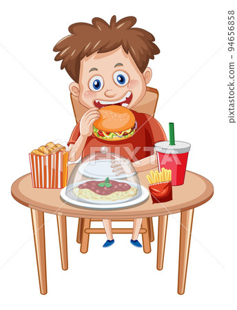 A boy enjoying junk food meal at the table 94656858