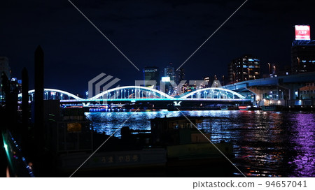 Impressed by the night view of Umaya Bridge and reflections on the water surface from the Sumida River Terrace Impressed by the night view of Umaya Bridge and reflections on the water surface from the Sumida River Terrace 94657041