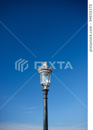 Victorian streetlight against sky Victorian streetlight against sky 94658378