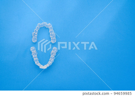 clear invisible aligners or braces used in orthodontics 94659985
