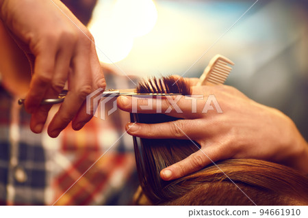 Time for a new hairdo. Handsome young bearded man came to the barber for a haircut. hipster style. Time for a new hairdo. Handsome young bearded man came to the barber for a haircut. hipster style. 94661910