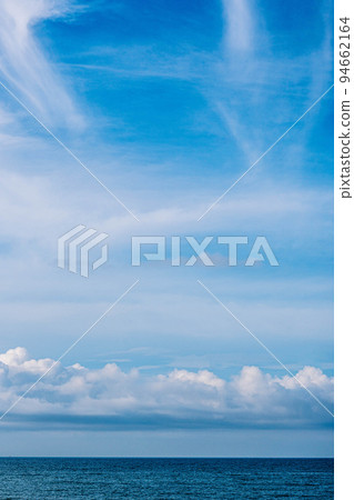 Atmosphere VERTICAL panorama real photo beauty nature wallpaper. Fantastic sky view clouds cumulus cirrus stratus sea horizon line. Wallpaper design background like painted fairy tale mood Atmosphere VERTICAL panorama real photo beauty nature wallpaper. Fantastic sky view clouds cumulus cirrus stratus sea horizon line. Wallpaper design background like painted fairy tale mood 94662164
