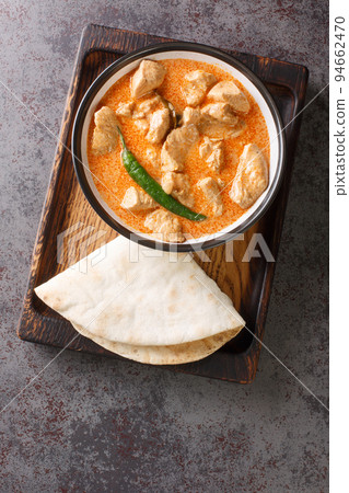 Kukul Mas Maluwa Sri Lankan Chicken Curry closeup in the bowl. Vertical top view 94662470