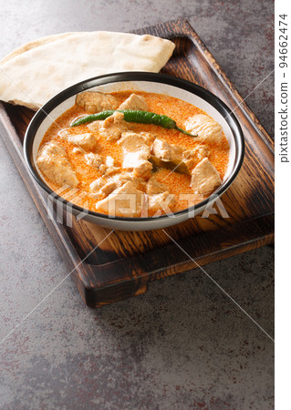 Kukul Mas Maluwa Sri Lankan Chicken Curry closeup in the bowl. Vertical Kukul Mas Maluwa Sri Lankan Chicken Curry closeup in the bowl. Vertical 94662474