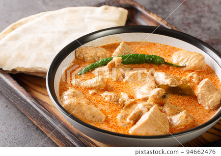 Chicken curry with coconut milk and sri lanka spices in a bowl. Horizontal 94662476