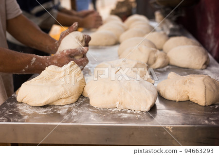 process of making bread. dough kneading 94663293