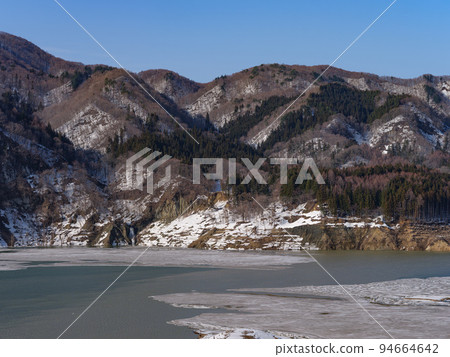 Lake Tsugaru Shirakami on a sunny winter day - Tsugaru Dam 94664642
