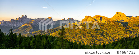 Dolomites panoramic view at morning sunrise time Dolomites panoramic view at morning sunrise time 94664732