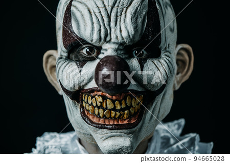 creepy evil clown staring at the observer 94665028