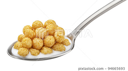 Corn balls with milk in spoon isolated on white background 94665693