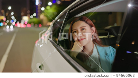 businesswoman commute in cab 94666068