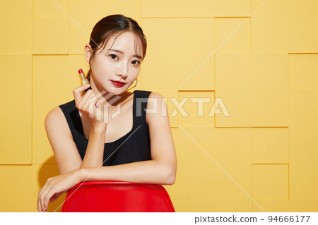 Chic fashion portrait of young woman in black dress Chic fashion portrait of young woman in black dress 94666177