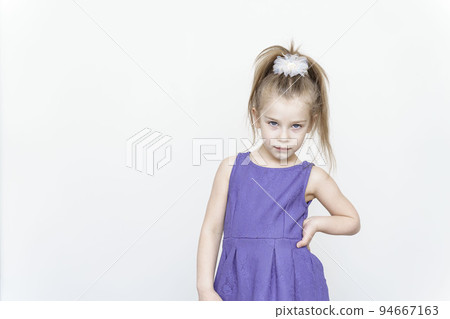 portrait of a cute 5 year old girl on a light background 94667163