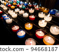 Colorful candles in church 94668187