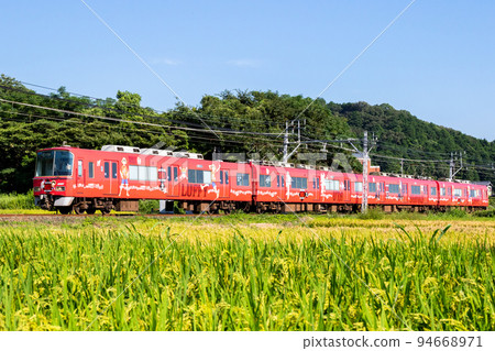[Meitetsu Nagoya Main Line] Local train running through rural scenery 94668971