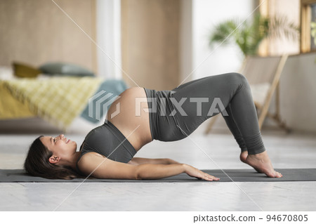 Prenatal Sport. Pregnant Young Female Training On Fitness Mat At Home Prenatal Sport. Pregnant Young Female Training On Fitness Mat At Home 94670805