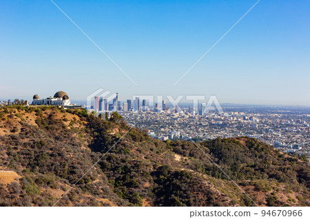 Sunny view of the Los Angeles cityscape with Griffith Observatory Sunny view of the Los Angeles cityscape with Griffith Observatory 94670966
