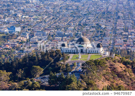 Sunny view of the Los Angeles cityscape with Griffith Observatory Sunny view of the Los Angeles cityscape with Griffith Observatory 94670987