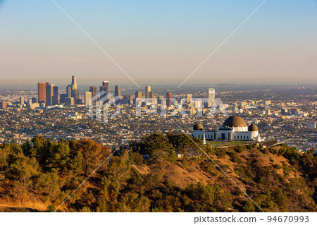 Sunset view of the Los Angeles cityscape with Griffith Observatory Sunset view of the Los Angeles cityscape with Griffith Observatory 94670993