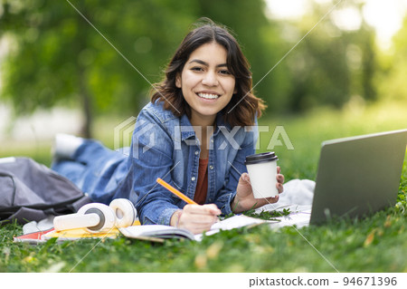 Beautiful Young Arab Woman Study With Laptop And Notepad Outdoors In Park 94671396