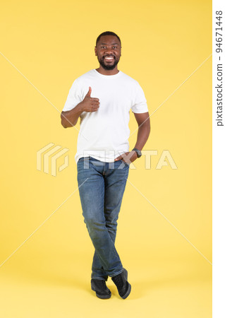 Positive Black Guy Gesturing Thumbs Up Posing Over Yellow Background Positive Black Guy Gesturing Thumbs Up Posing Over Yellow Background 94671448